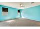 Spacious bedroom featuring two windows, ceiling fan, and neutral carpeting at 19685 W Roma Ave, Litchfield Park, AZ 85340