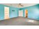 This spacious bedroom features gray carpet and connections to a closet and bathroom at 19685 W Roma Ave, Litchfield Park, AZ 85340