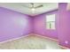 Bedroom with wood-look floors and a ceiling fan at 19685 W Roma Ave, Litchfield Park, AZ 85340