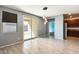 Open dining area featuring stylish pendant lighting and sliding glass doors leading to the backyard at 19685 W Roma Ave, Litchfield Park, AZ 85340