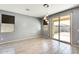 Open dining area featuring stylish pendant lighting and sliding glass doors to the backyard patio at 19685 W Roma Ave, Litchfield Park, AZ 85340