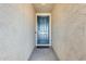 Stylish blue front door with decorative trim in a stucco wall entryway, creating a welcoming entrance at 19685 W Roma Ave, Litchfield Park, AZ 85340