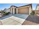 Inviting single-story house with a well-kept lawn and a two-car garage, in a peaceful neighborhood at 19685 W Roma Ave, Litchfield Park, AZ 85340