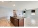 Kitchen with a large island, stainless steel dishwasher, granite counters, and an open floor plan at 19685 W Roma Ave, Litchfield Park, AZ 85340