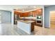 Modern kitchen with stainless steel appliances, granite counters, and a central island at 19685 W Roma Ave, Litchfield Park, AZ 85340