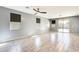 Bright living room with sliding doors leading to the backyard and stylish tile flooring at 19685 W Roma Ave, Litchfield Park, AZ 85340