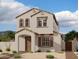 Charming two-story home with a tan stucco exterior, arched entry, and tile roof at 1974 W Lariat Ln, Phoenix, AZ 85085