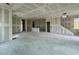 Expansive living area displaying drywall, multiple entryways and windows, awaiting personalization at 1974 W Lariat Ln, Phoenix, AZ 85085
