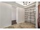 Spare bedroom featuring slate flooring and a built-in shelving unit at 2048 W Elm St, Phoenix, AZ 85015