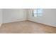 Bright bedroom featuring tile flooring and a large window at 2048 W Elm St, Phoenix, AZ 85015