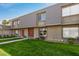 Charming townhouse with well-maintained landscaping and inviting facade with multiple windows and a welcoming entrance at 2048 W Elm St, Phoenix, AZ 85015
