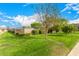 Beautifully maintained community lawn featuring vibrant green grass and thoughtfully landscaped greenery for residents to enjoy at 2048 W Elm St, Phoenix, AZ 85015