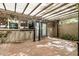 Inviting outdoor patio featuring a shaded pergola, providing a tranquil retreat with views of the surrounding greenery at 2048 W Elm St, Phoenix, AZ 85015