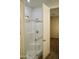 Modern bathroom with a glass-enclosed shower and white tiled walls at 2206 S Ellsworth Rd # 14 B, Mesa, AZ 85209