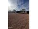 Large backyard with gravel and a covered patio, ideal for outdoor activities and relaxation at 2224 W Fairmount Ave, Phoenix, AZ 85015