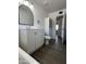 Clean bathroom with a vanity, toilet, linen closet, and neutral decor at 2224 W Fairmount Ave, Phoenix, AZ 85015