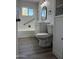 Bright bathroom featuring a shower/tub combo and modern vanity at 2224 W Fairmount Ave, Phoenix, AZ 85015
