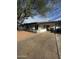 Charming home featuring a covered carport and a well-maintained front yard with mature landscaping at 2224 W Fairmount Ave, Phoenix, AZ 85015