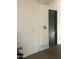 Functional garage interior featuring built-in storage and an entry door, blending utility with practicality at 2224 W Fairmount Ave, Phoenix, AZ 85015