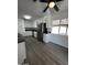 Bright kitchen features modern appliances, white cabinetry, and wood-style flooring at 2224 W Fairmount Ave, Phoenix, AZ 85015