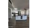 Spacious kitchen with island, stainless steel appliances, and updated flooring at 2224 W Fairmount Ave, Phoenix, AZ 85015