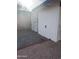 Outdoor storage area featuring a shed with secure doors, nestled in a gravel-filled yard at 2224 W Fairmount Ave, Phoenix, AZ 85015