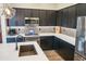 Close-up of the gourmet kitchen highlighting stainless steel appliances, white countertops, and attractive mosaic backsplash at 250 W Queen Creek Rd # 229, Chandler, AZ 85248