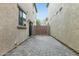 Private patio area with stone pavers and decorative tiled wall, perfect for outdoor relaxation and entertaining at 25824 N 54Th Ave, Phoenix, AZ 85083