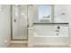 Bathroom features a tiled tub and a shower at 25824 N 54Th Ave, Phoenix, AZ 85083