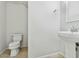Cozy half bath with neutral walls and tile flooring, providing a fresh and clean look at 25824 N 54Th Ave, Phoenix, AZ 85083