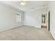 Bedroom with carpet, ceiling fan, a window with blinds and a doorway at 25824 N 54Th Ave, Phoenix, AZ 85083