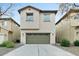 Tan two-story home with a two-car garage and desert landscaping at 25824 N 54Th Ave, Phoenix, AZ 85083