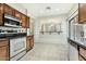Well-lit kitchen featuring stainless steel appliances, tile flooring, and wood cabinets at 25824 N 54Th Ave, Phoenix, AZ 85083