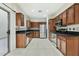 A kitchen featuring wood cabinets, stainless steel appliances, and tile flooring at 25824 N 54Th Ave, Phoenix, AZ 85083