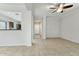 A view of the open-concept living room with tile flooring and a ceiling fan at 25824 N 54Th Ave, Phoenix, AZ 85083