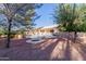 Expansive backyard featuring a patio, pool, and desert landscaping perfect for outdoor living at 26242 S Thistle Ln, Sun Lakes, AZ 85248