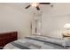 Bedroom featuring wood-look flooring, ceiling fan, closet and access to ensuite bathroom at 26242 S Thistle Ln, Sun Lakes, AZ 85248