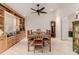 Formal dining room featuring built-in shelving, wainscoting, and neutral color palette at 26242 S Thistle Ln, Sun Lakes, AZ 85248