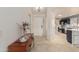 Bright entryway leading to an updated kitchen with granite countertops and stainless steel appliances at 26242 S Thistle Ln, Sun Lakes, AZ 85248