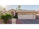 Charming single-story home with a two-car garage and well maintained desert landscaping at 26242 S Thistle Ln, Sun Lakes, AZ 85248