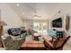 The living room has modern decor, tile floors, and sliding glass door to the pool at 26242 S Thistle Ln, Sun Lakes, AZ 85248