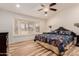 This main bedroom has carpet, a bay window seat, and sconce lighting at 26242 S Thistle Ln, Sun Lakes, AZ 85248