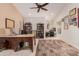 Spacious home office with custom desk, neutral walls, and large decorative rug at 26242 S Thistle Ln, Sun Lakes, AZ 85248