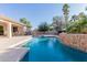 Sparkling pool with rock features and a spacious patio, perfect for entertaining and enjoying the Arizona sun at 26242 S Thistle Ln, Sun Lakes, AZ 85248