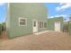 Backyard with gravel, a patio, and green walls at 2715 E Windsor Ave, Phoenix, AZ 85008