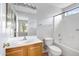 Clean bathroom with a single sink vanity, mirror, toilet, and shower/tub combo at 2715 E Windsor Ave, Phoenix, AZ 85008