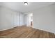 Bedroom boasts wood laminate flooring, neutral colors, and three closets at 2715 E Windsor Ave, Phoenix, AZ 85008