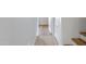 Hallway with tiled floor leads to staircase with wood laminate flooring at 2715 E Windsor Ave, Phoenix, AZ 85008