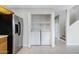 Bright laundry area with stainless steel refrigerator and new washer/dryer at 2715 E Windsor Ave, Phoenix, AZ 85008