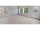 Sunny living room with tile floors, bright neutral walls, and plenty of natural light at 2715 E Windsor Ave, Phoenix, AZ 85008